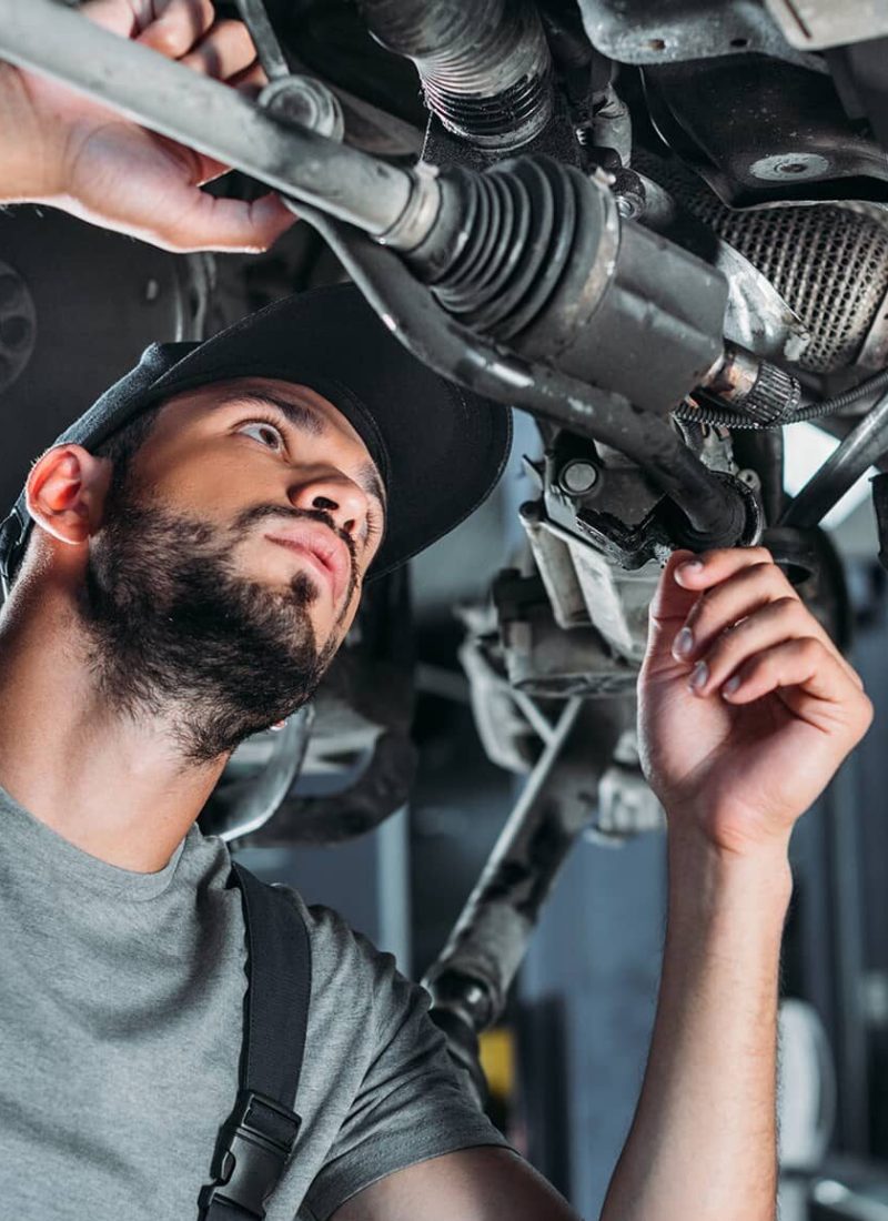 mechanic-in-overalls-repairing-car-in-auto-repair-2022-12-16-18-39-34-utc.jpg